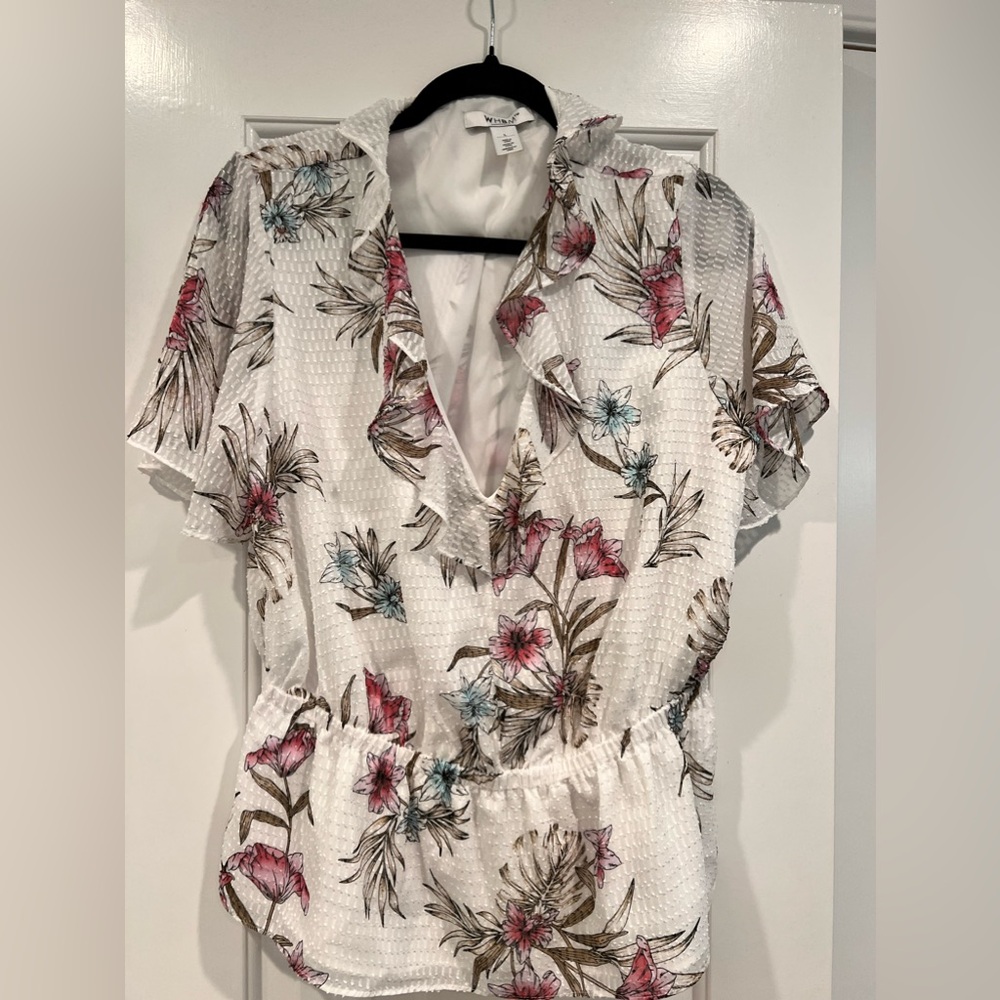 Floral top with sheer sleeves.